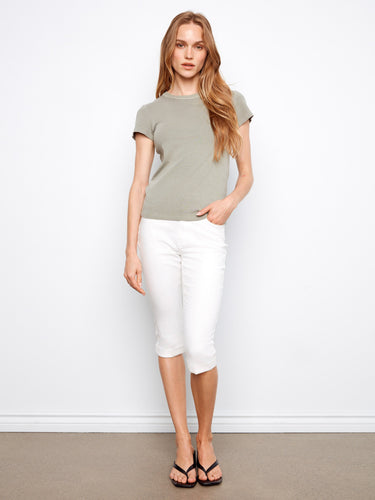 The ribbed texture of this semi-fitted top adds subtle detail, enhancing its stylish and modern look by Charlie B.
