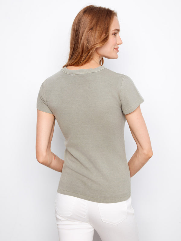 Showcasing a ribbed texture, this top provides added dimension and style to your wardrobe essentials by Charlie B.