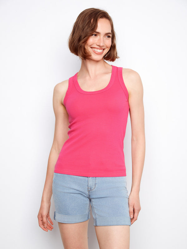 Highlighted by wide straps, this pink tank top offers both style and support. A versatile choice for your wardrobe by Charlie B.