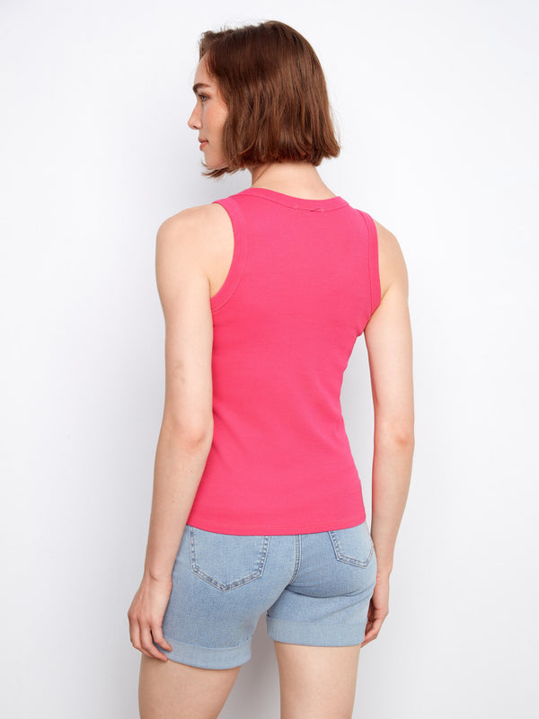 The soft fabric of this pink tank provides comfort and breathability, making it an essential piece for layering or wearing alone by Charlie B.