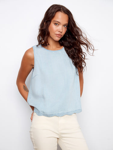 Designed with a scallop hem, this sleeveless top offers an elegant and unique finish to your outfit. By Charlie B.