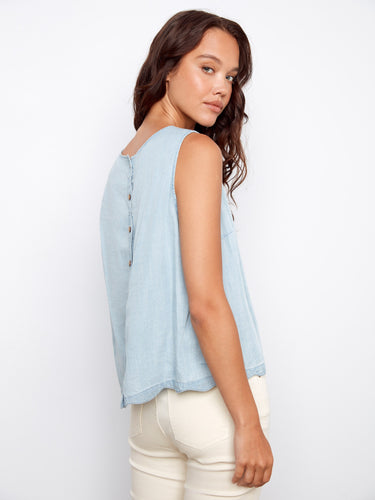 With its sleeveless design, this versatile top is ideal for layering or wearing on warm days out. By Charlie B.