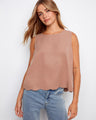 Chic sleeveless top with a scallop hem, paired with jeans for a relaxed look. Perfect for casual outings by Charlie B.