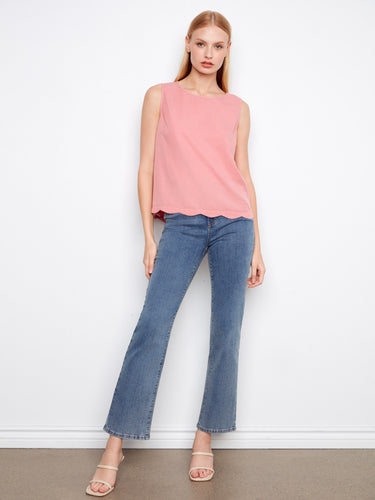 Chic pink top with a scallop hem adds a touch of elegance to your wardrobe essentials. By Charlie B.
