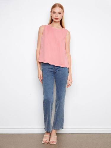 Casual yet refined, this sleeveless design in soft pink is perfect for layering or wearing alone. By Charlie B.