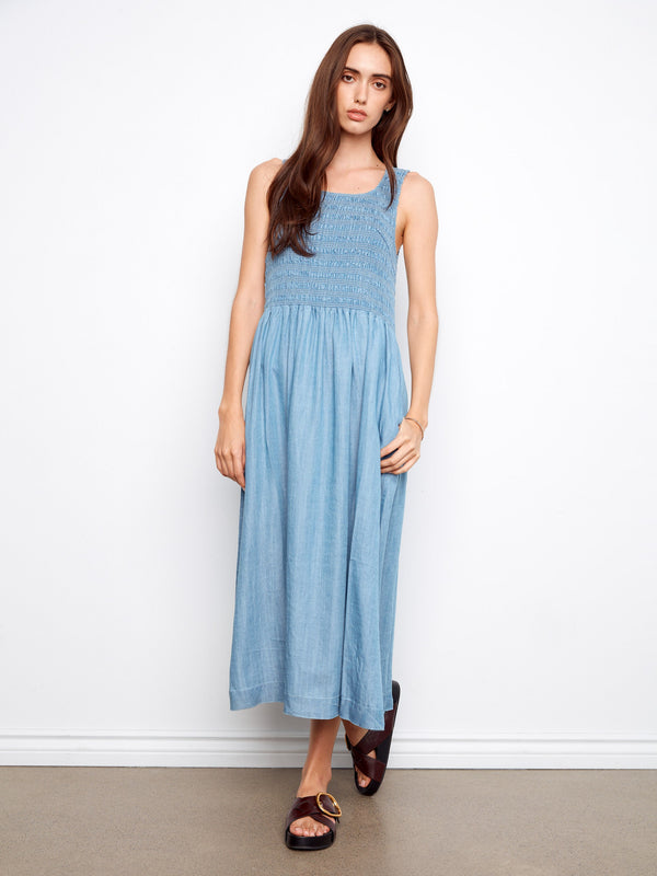Blue Tencel maxi dress with a scoop neckline, featuring convenient side pockets for added style by Charlie B.