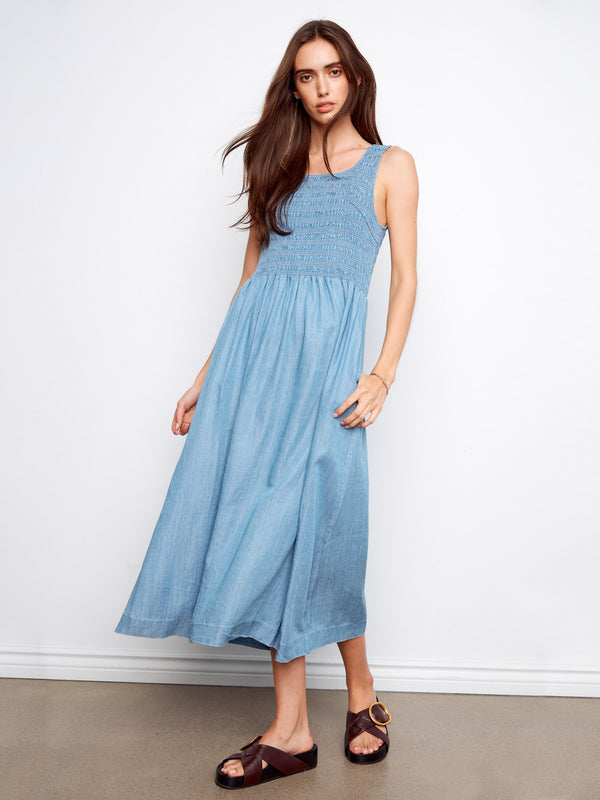 Chic blue sleeveless maxi dress crafted from Tencel, showcasing a smocked bodice for an elegant touch by Charlie B.