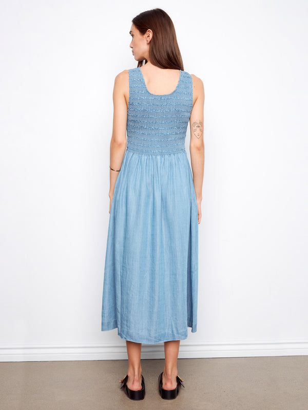 Elegant blue maxi dress in soft Tencel, highlighted by its flattering scoop neckline design by Charlie B.