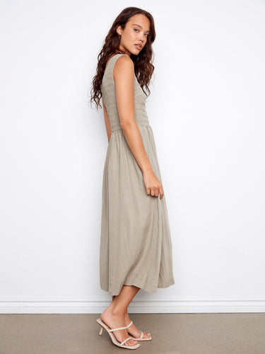 The smocked bodice adds texture and elegance to this stylish dress, making it a versatile wardrobe staple. By Charlie B.