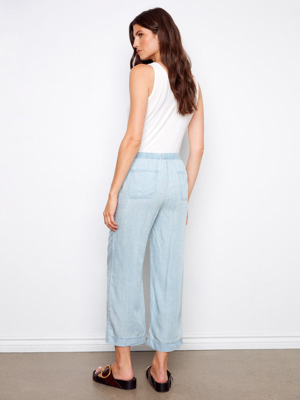 Experience ultimate comfort with these wide-leg joggers in a light blue hue, featuring a versatile elastic waistband by Charlie B.