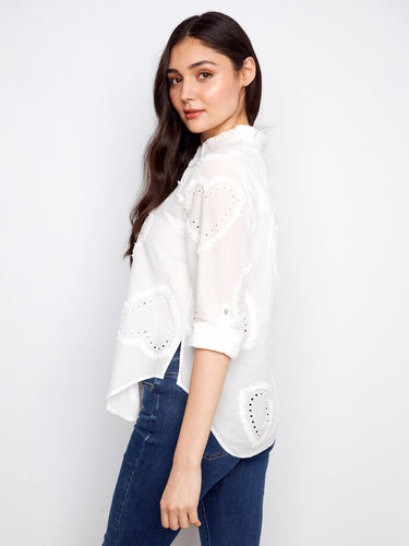 The structured shirt collar gives this piece an elegant touch, enhancing its sophisticated appeal. By Charlie B.