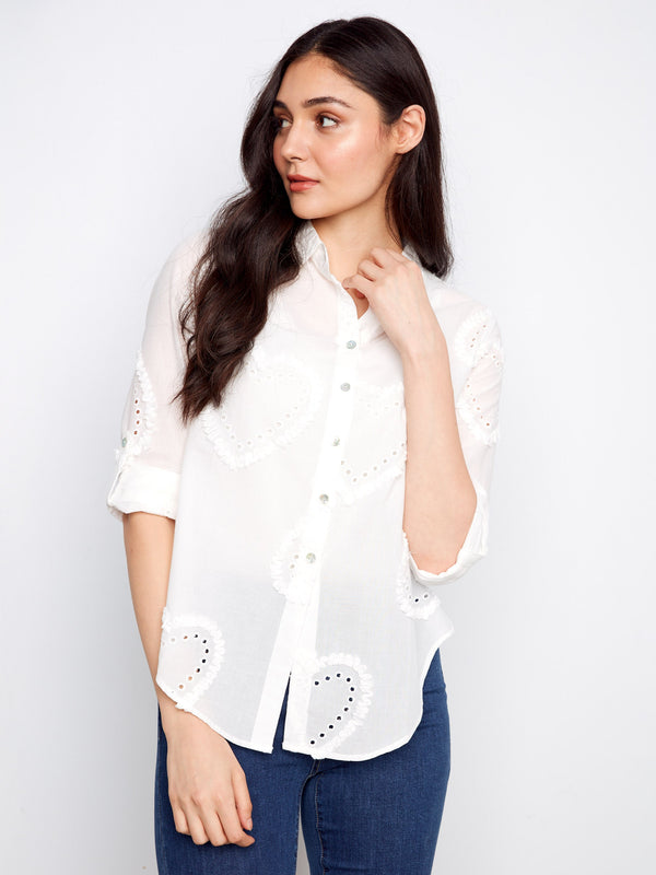 Button-down feature ensures ease of wear while maintaining a sleek silhouette in this stylish top. By Charlie B.