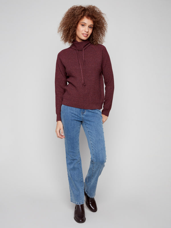 Elegant textured front design on this knit sweater adds a touch of sophistication to your look by Charlie B.
