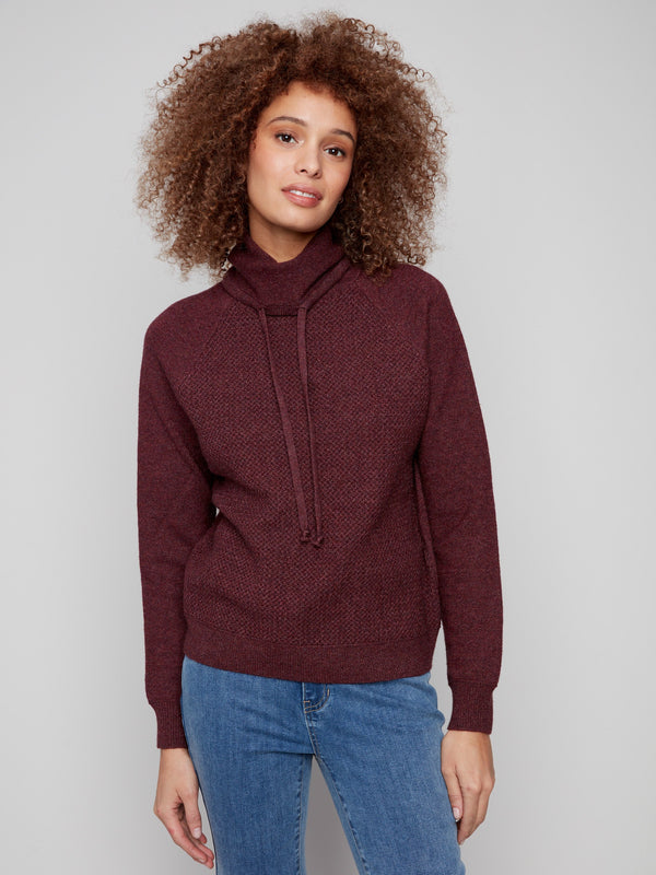 The raglan sleeves offer comfort and style in this Heather Cabernet knit sweater by Charlie B.