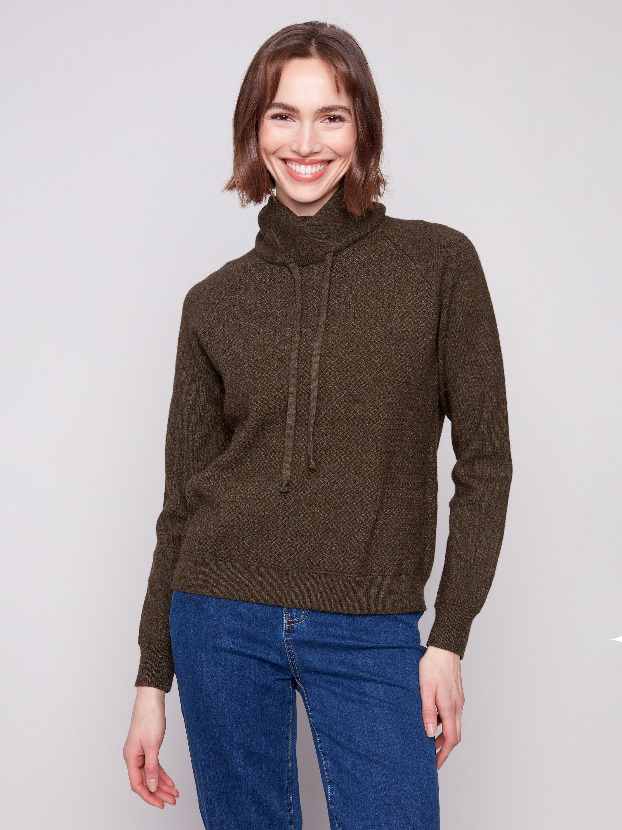Spruce knit sweater with a cozy cowl neck and adjustable drawstring for versatile styling by Charlie B.