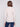 Elegant slim-fit oat sweater teamed with classic blue jeans, perfect for any casual outing by Charlie B.