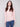 Ballet pink slim fit sweater with a textured finish and blue jeans ensemble by Charlie B.