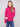 Sophisticated slim fit hibiscus sweater in a vibrant hue, complemented by blue jeans by Charlie B.