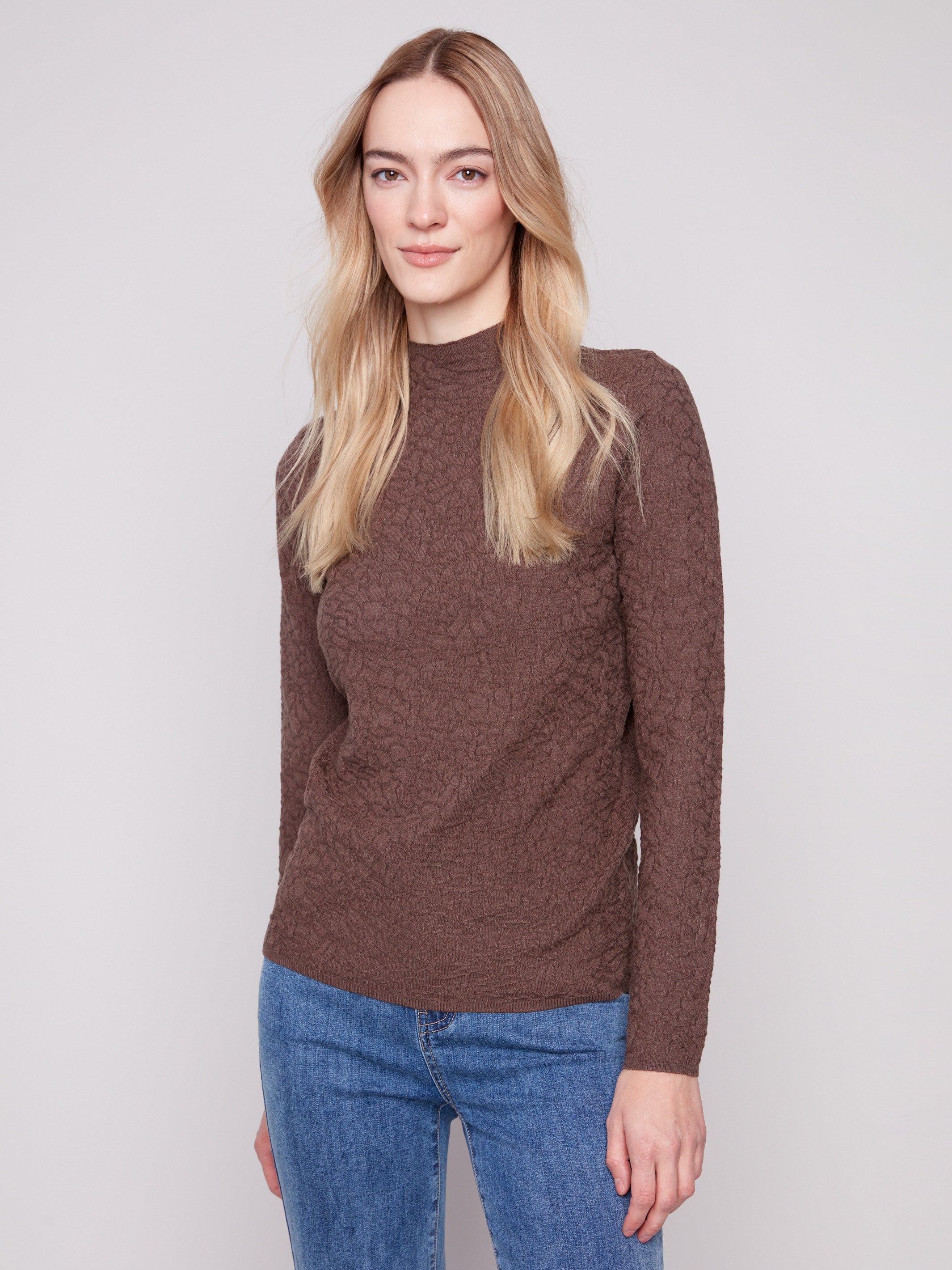 Mocha sweater featuring a slim fit, paired with blue jeans, offering a chic and comfortable style by Charlie B.