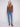 Textured mocha sweater styled elegantly with blue jeans, showcasing a modern fashion statement by Charlie B.