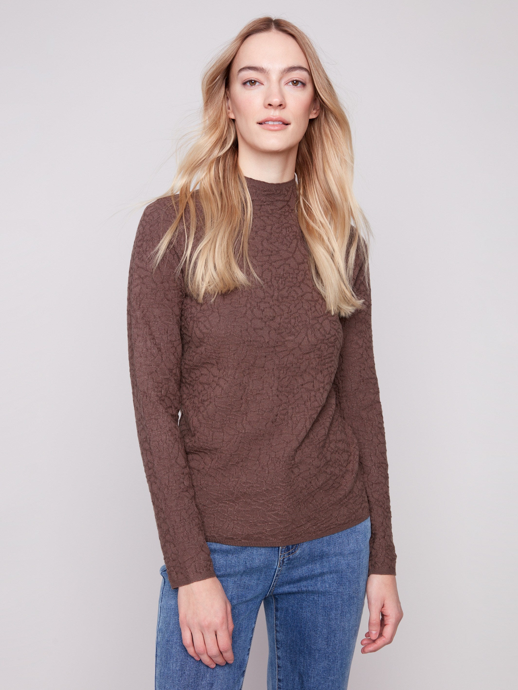 Stylish mocha sweater in a slim fit design paired with classic blue jeans for a contemporary look by Charlie B.
