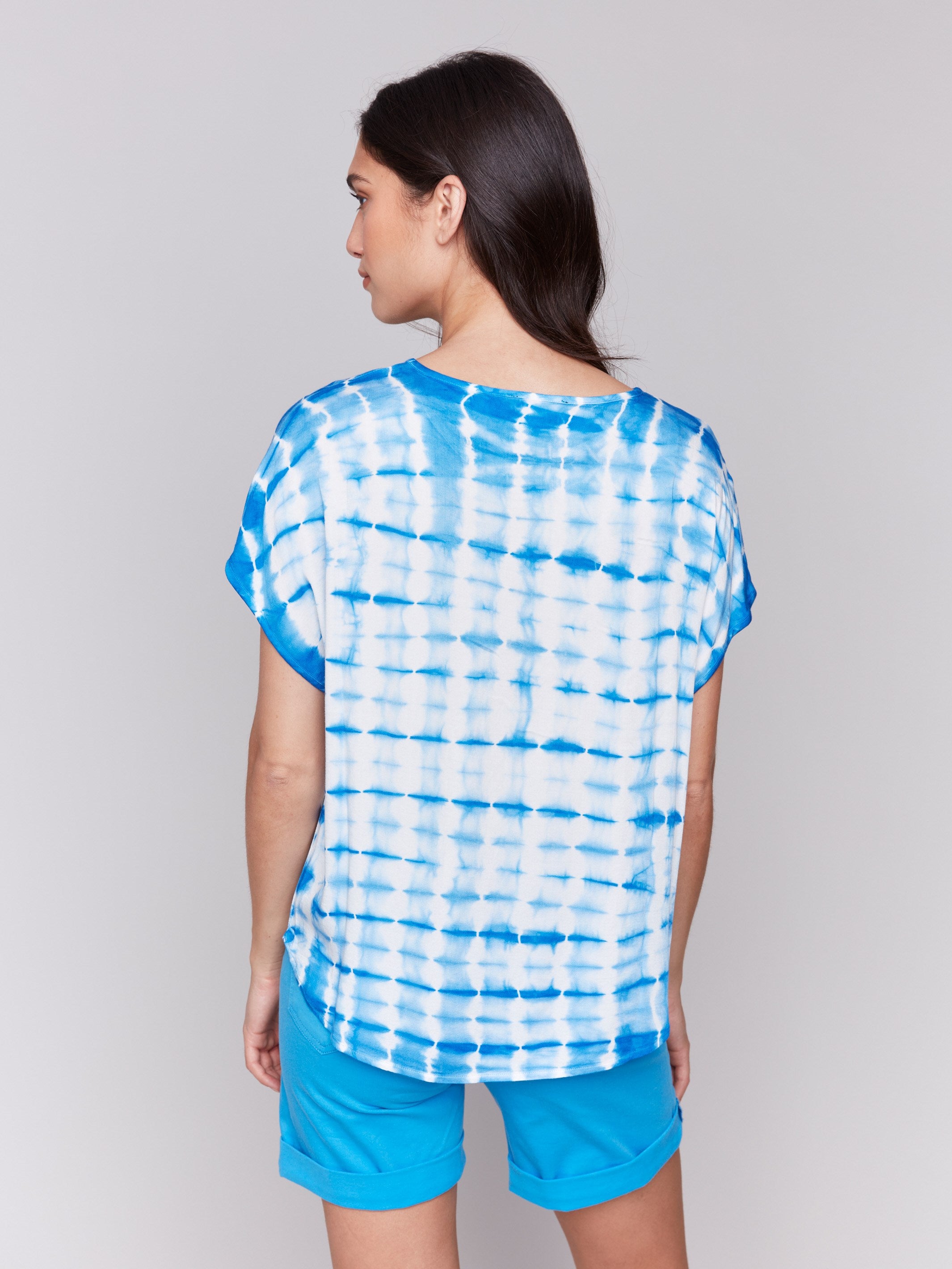 Rounded hem azure top with a stylish design by Charlie B.
