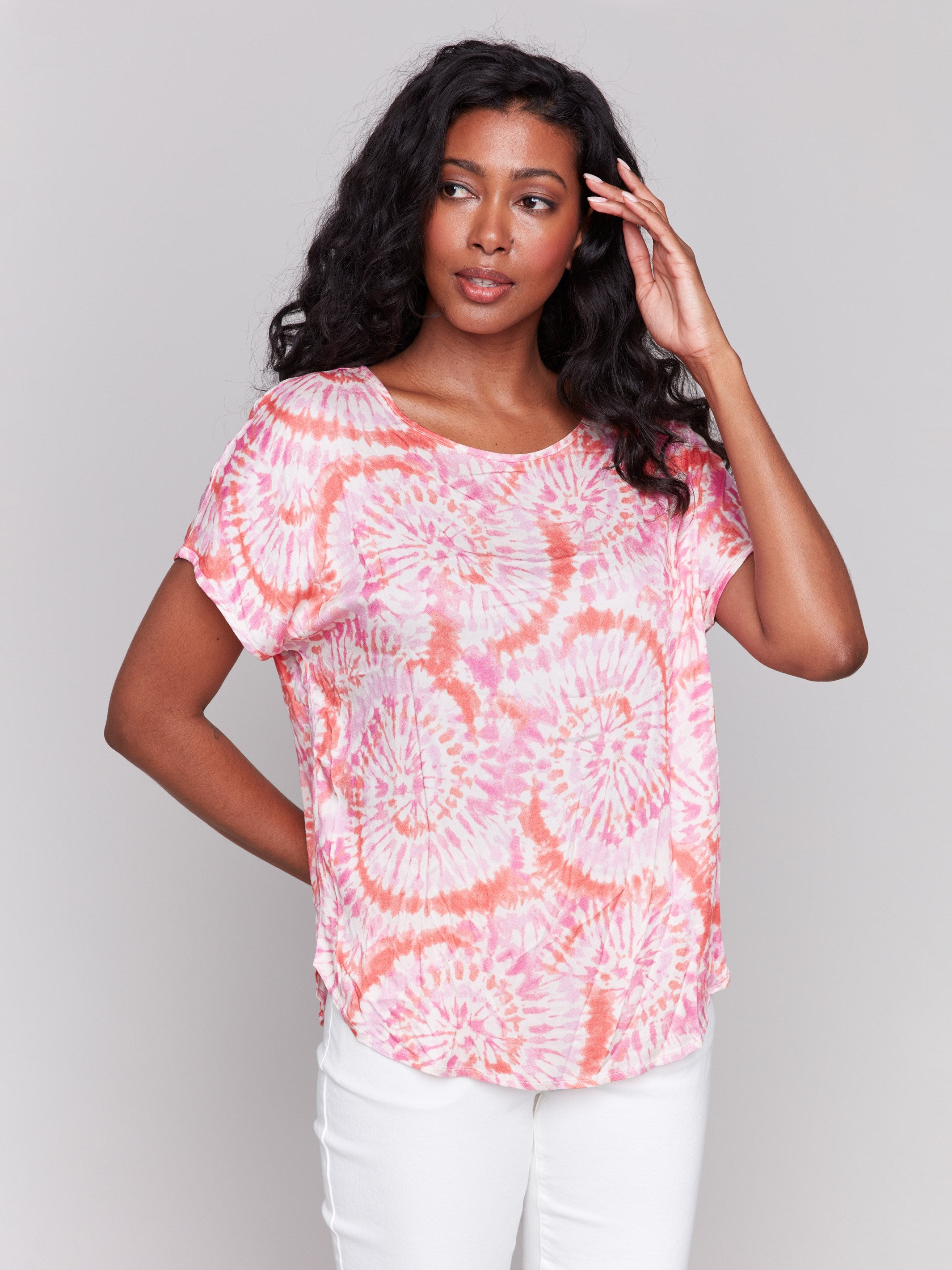 Pink and orange dolman top with a round neckline by Charlie B.