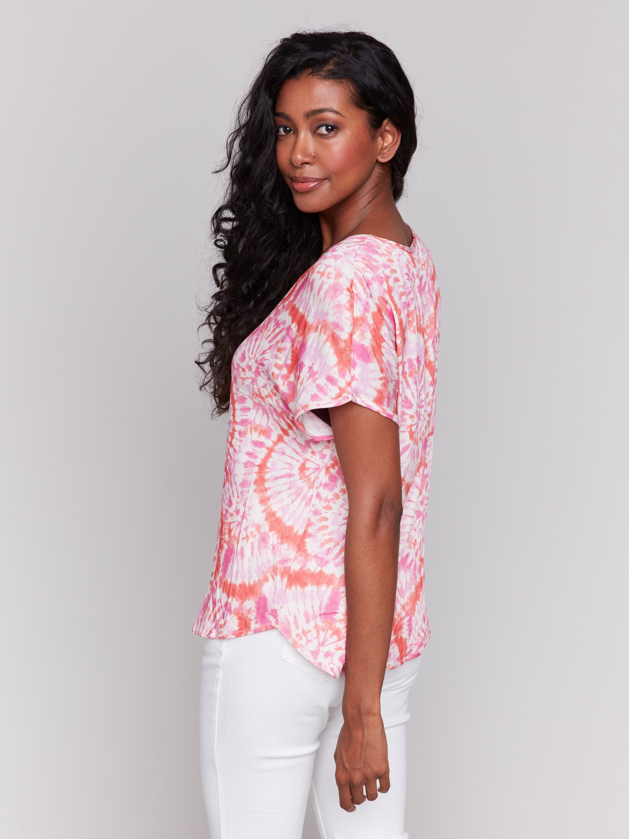 Short dolman sleeves on a vibrant tie-dye top by Charlie B.