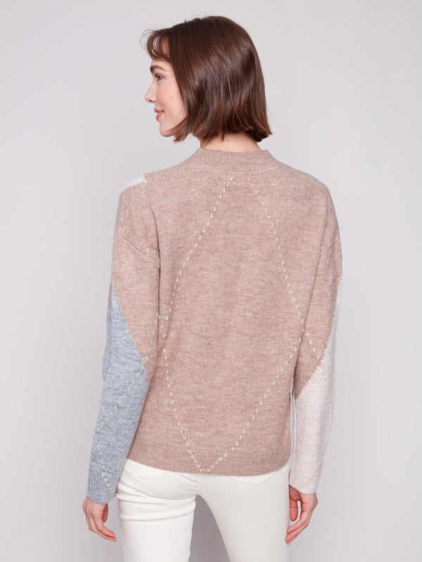 Elegant argyle sweater in Heather Sesame with jacquard detailing, complemented by classic long sleeves by Charlie B.