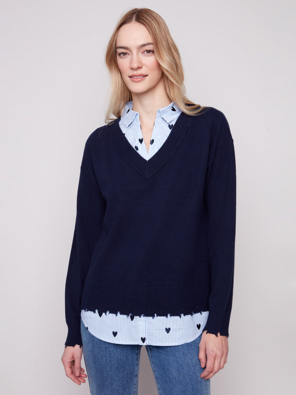 Navy sweater featuring long sleeves and a poplin shirt collar with heart embroidery, offering a stylish layered design by Charlie B.