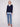 Chic navy V-neck sweater with side slits and heart details, paired beautifully with an embroidered poplin shirt collar by Charlie B.