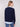 Stylish V-neck navy sweater featuring an embroidered poplin shirt collar and side slits for added flair by Charlie B.