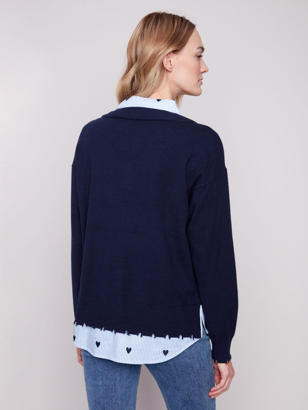Stylish V-neck navy sweater featuring an embroidered poplin shirt collar and side slits for added flair by Charlie B.