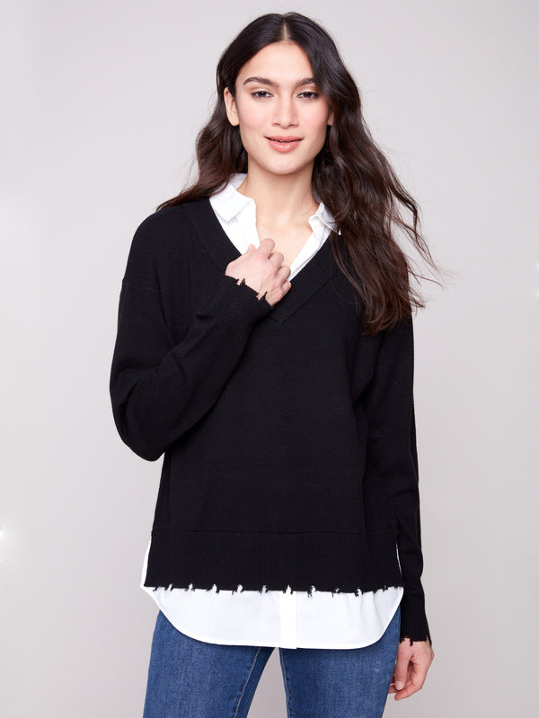 Black sweater featuring long sleeves and a chic layered design by Charlie B.