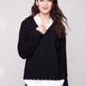 Black sweater featuring long sleeves and a chic layered design by Charlie B.