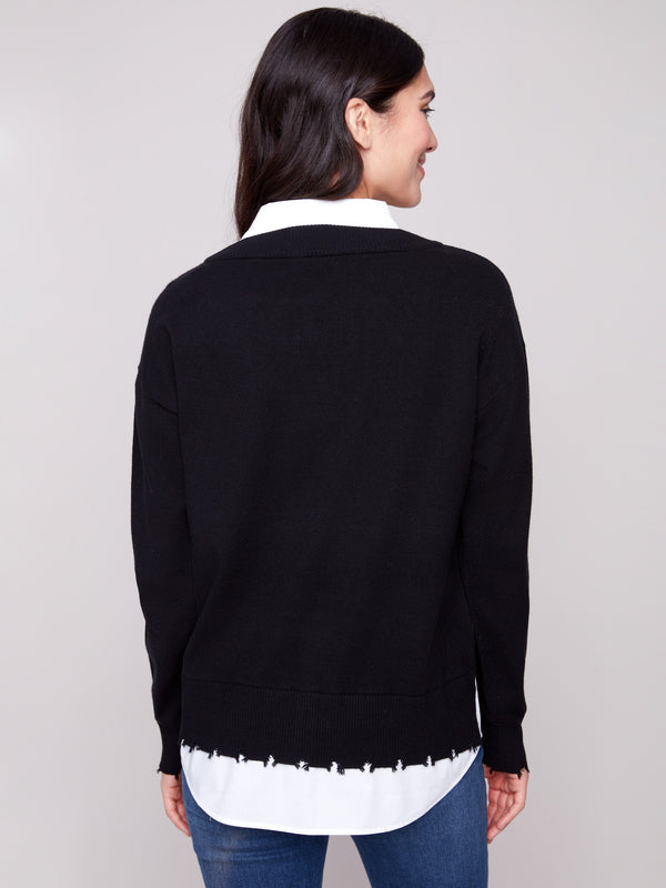 Stylish black sweater showcasing a frayed finish at cuffs and hem by Charlie B.