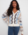 Geometric jacquard cardigan with ribbed cuffs and hem, featuring a stylish pattern by Charlie B.