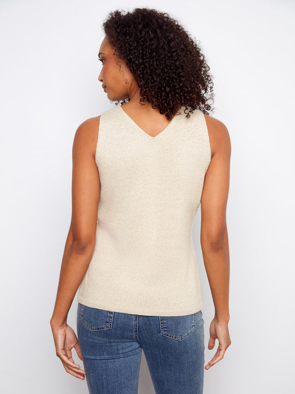 Trendy V-neck sweater cami in gold with eye-catching white heart motif, great for any season by Charlie B.
