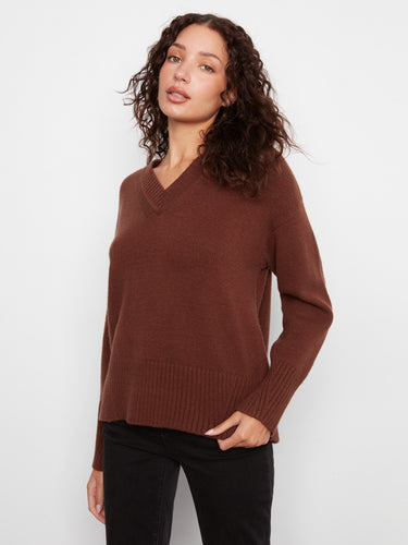 Ribbed details on the hem and cuffs add texture and style to this classic piece, making it a wardrobe staple. By Charlie B.
