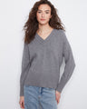 Grey knit sweater featuring a stylish V-neckline and ribbed cuffs, perfect for cozy days by Charlie B.