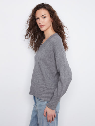 This grey V-neck sweater offers ribbed details that add texture and style to any outfit by Charlie B.