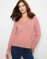 Pink sweater with a flattering V-neckline, crafted for a stylish look by Charlie B.