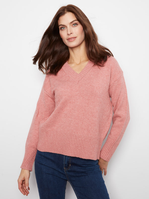 Pink sweater with a flattering V-neckline, crafted for a stylish look by Charlie B.