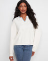 Sweater featuring a V-notch neckline with woven trim adds a unique touch, perfect for casual outings. By Charlie B.