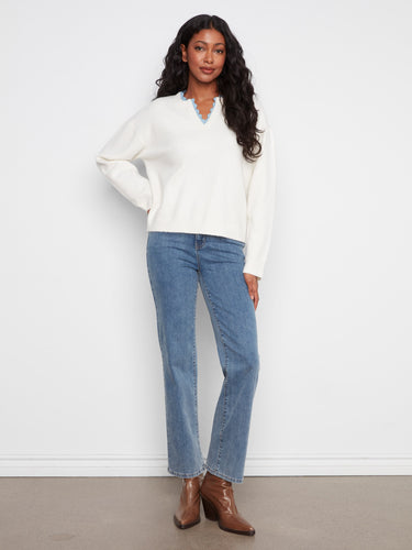 This cozy sweater showcases drop shoulders, offering a relaxed and trendy look for everyday wear. By Charlie B.
