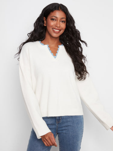 Enjoy the comfort of this sweater's relaxed fit, ideal for pairing with jeans or skirts. By Charlie B.
