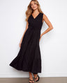 The dress features a sophisticated V-neckline that enhances its elegant appeal by Charlie B.