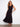 The dress features a sophisticated V-neckline that enhances its elegant appeal by Charlie B.