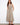 Elegant dress featuring a V-neckline and sleeveless design, perfect for warm weather. By Charlie B.