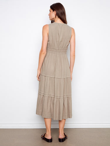 Sophisticated tiered dress showcasing a flattering silhouette in a maxi length cut. By Charlie B.